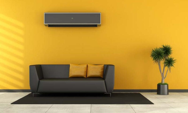 A colorful living room showing why you should consider a ductless AC system for your home.