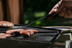 Image of someone grilling. Video - Energy Saving Tip 1.