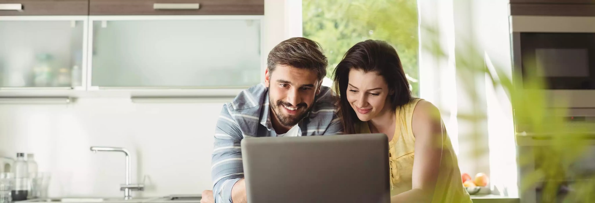 couple learning on laptop.